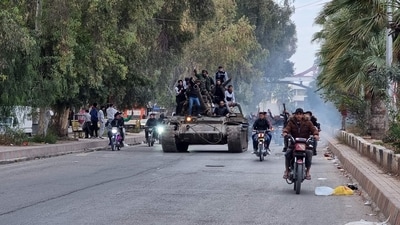 People ride a tank in the Syrian southern city of Daraa after the collapse of government forces. (AFP) People ride a tank in the Syrian southern city of Daraa after the collapse of government forces. (AFP)