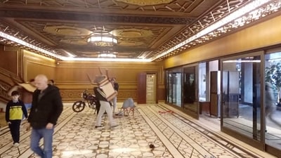 People carry furniture as they leave Al-Rawda Presidential Palace in Damascus, Syria, December 8, 2024 in this screen grab taken from a video obtained by Reuters. VIDEO OBTAINED BY REUTERS/Handout via REUTERS THIS IMAGE HAS BEEN SUPPLIED BY A THIRD PARTY (via REUTERS)