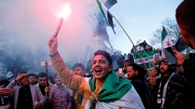 Syrians living in Turkey celebrate after Syrian rebels announced that they had ousted President Bashar al-Assad in Syria, in Istanbul, Turkey, December 8, 2024. (REUTERS)