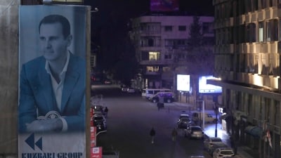 A giant portrait of Syrian president Bashar Assad sets on a building, as empty streets seen in Damascus, Syria. (AP) A giant portrait of Syrian president Bashar Assad sets on a building, as empty streets seen in Damascus, Syria. (AP)