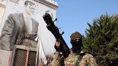 A rebel fighter poses for a selfie picture in one of Hama's water wheels, or norias, after they captured the central Syrian city. (AFP) A rebel fighter poses for a selfie picture in one of Hama's water wheels, or norias, after they captured the central Syrian city. (AFP)