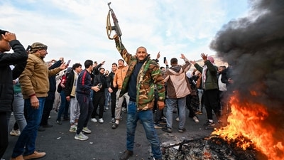 People celebrate at Umayyad Square in Damascus. (AFP) People celebrate at Umayyad Square in Damascus. (AFP)