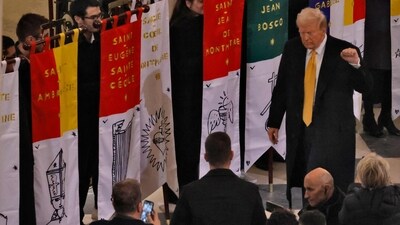 US President-elect Donald Trump gestures as he enters inside Notre-Dame Cathedral ahead of a ceremony. (AFP) US President-elect Donald Trump gestures as he enters inside Notre-Dame Cathedral ahead of a ceremony. (AFP)