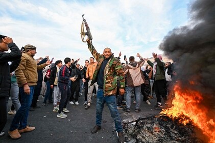 People celebrate at Umayyad Square in Damascus. (AFP) People celebrate at Umayyad Square in Damascus. (AFP)