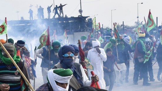 Patiala: Tear gas being used to disperse protesting farmers at Shambhu Border during their foot march towards Delhi. (PTI)