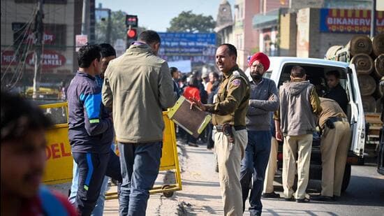 Police at the shooting site at Vishwas Nagar in New Delhi on Saturday. (Sanchit Khanna/HT Photo)