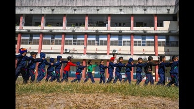 Children play on the premises of a school in New Delhi on December 3, 2024. (Photo by Arun SANKAR / AFP) (AFP) Children play on the premises of a school in New Delhi on December 3, 2024. (Photo by Arun SANKAR / AFP) (AFP)