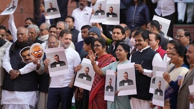 LoP in the Rajya Sabha Mallikarjun Kharge, (left) and LoP in the Lok Sabha Rahul Gandhi (second left), and other INDIA bloc MPs stage a protest over indictment of industrialist Gautam Adani by a US court in a bribery case, during the Winter session of Parliament, on Monday. (PTI) LoP in the Rajya Sabha Mallikarjun Kharge, (left) and LoP in the Lok Sabha Rahul Gandhi (second left), and other INDIA bloc MPs stage a protest over indictment of industrialist Gautam Adani by a US court in a bribery case, during the Winter session of Parliament, on Monday. (PTI)