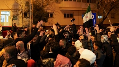 Syrians across the world celebrated after the rebels announced that they have ousted president Bashar al-Assad from Syria.  (Reuters)