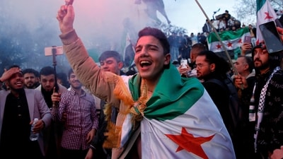 Syrians living in Turkey celebrate after Syrian rebels announced that they had ousted President Bashar al-Assad in Syria, in Istanbul, Turkey, December 8, 2024. (REUTERS)