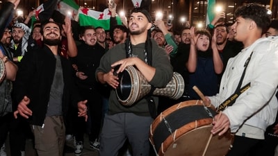 Syrian-Americans and supporters in US' Michigan celebrate after the fall of Assad's regime in Syria.  (Reuters)