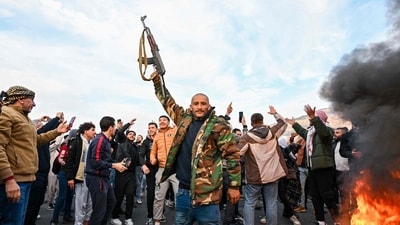 People celebrate at Umayyad Square in Damascus. (AFP) People celebrate at Umayyad Square in Damascus. (AFP)