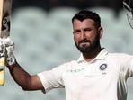 Cheteshwar Pujara celebrates after scoring a century during the first Test against Australia at Adelaide Oval in 2018.