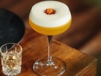 The cocktail is a combination of vanilla vodka, passion fruit purée, lime juice, and a shot of Prosecco or Champagne on the side.