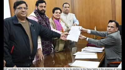 Bharatiya Janata Party nominee and former National Commission for Women chief Rekha Sharma submitting her nomination paper for Rajya Sabha bypoll in presence of Chief minister Nayab Singh Saini, state BJP chief Mohan Lal Badoli and cabinet minister Vipul Goel before the returning officer at the Haryana Assembly Secretariat in Chandigarh on Tuesday. (HT Photo)