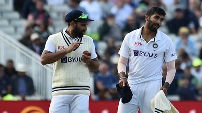 India's Jasprit Bumrah (R) interacts with teammate Mohammed Shami (AP) India's Jasprit Bumrah (R) interacts with teammate Mohammed Shami (AP)