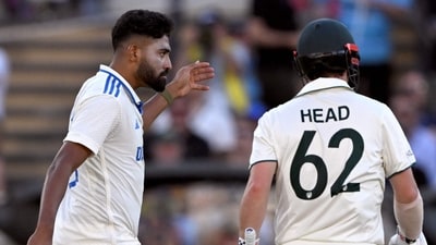 Indian bowler Mohammed Siraj (L) gestures to Australian batsman Travis Head (R) on the second day of the Adelaide Test. (Photo by William WEST / AFP) (AFP) Indian bowler Mohammed Siraj (L) gestures to Australian batsman Travis Head (R) on the second day of the Adelaide Test. (Photo by William WEST / AFP) (AFP)