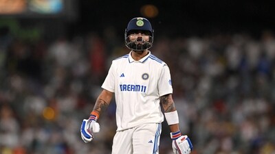 India's Virat Kohli looks dejected and walks back to the pavilion after losing his wicket, caught out by Australia's Alex Carey off the bowling of Scott Boland (AAP Image via REUTERS)
