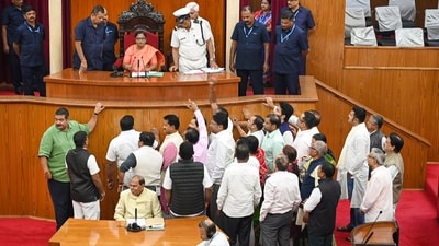 BJD MLAs raise slogans in the well of the Odisha Assembly, demanding the immediate release of salaries of the Mission Shakti women, on Tuesday. (PTI) BJD MLAs raise slogans in the well of the Odisha Assembly, demanding the immediate release of salaries of the Mission Shakti women, on Tuesday. (PTI)