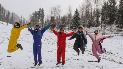 Manali: Tourists pose in the snow after fresh snowfall in Solang Valley, in Manali, Himachal Pradesh on Monday. (PTI)