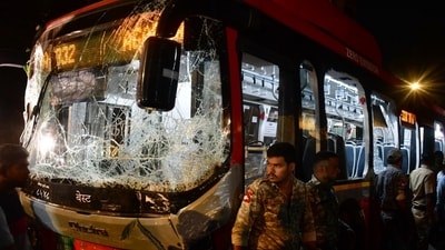 Security personnel near the damaged Brihanmumbai Electric Supply and Transport (BEST) undertaking's bus after it rammed into pedestrians as well as vehicles on a road at Kurla, in Mumbai, Monday.  (PTI)