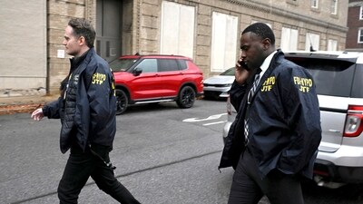 Members of a Joint Task Force with the FBI and the NYPD exit the Altoona Police Department, where suspect in the UnitedHealthcare CEO shooting 26-year old Luigi Mangione is being held Monday, Dec. 9, 2024, Altoona, Pa. (Benjamin B. Braun/Pittsburgh Post-Gazette via AP) (AP) Members of a Joint Task Force with the FBI and the NYPD exit the Altoona Police Department, where suspect in the UnitedHealthcare CEO shooting 26-year old Luigi Mangione is being held Monday, Dec. 9, 2024, Altoona, Pa. (Benjamin B. Braun/Pittsburgh Post-Gazette via AP) (AP)