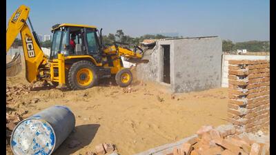 A team from the nodal enforcement authority demolishing illegal colonies in Behrampur on Wednesday. (Parveen Kumar/HT PHOTO) A team from the nodal enforcement authority demolishing illegal colonies in Behrampur on Wednesday. (Parveen Kumar/HT PHOTO)