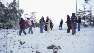 Shimla witnessed young women enjoying a snow-covered park after fresh snowfall on Monday. Temperatures plunged across Himachal Pradesh, with Tabo in Lahaul-Spiti recording the lowest at a bone-chilling -12.7°C. (PTI) Shimla witnessed young women enjoying a snow-covered park after fresh snowfall on Monday. Temperatures plunged across Himachal Pradesh, with Tabo in Lahaul-Spiti recording the lowest at a bone-chilling -12.7°C. (PTI)