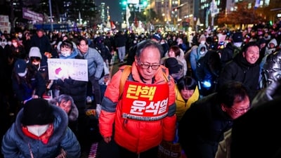A protester carries a sign that reads "Impeach Yoon Suk Yeol" during a rally calling for the impeachment of South Korean President Yoon Suk Yeol, who declared martial law, which was reversed hours later, in front of the National Assembly in Seoul, South Korea, December 10, 2024. (REUTERS)