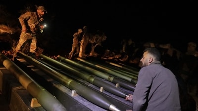 Turkish-backed Syrian fighters preparing rockets to be fired towards areas in northeastern Syria controlled by the Kurdish-led Syrian Democratic Forces (SDF). (AFP) Turkish-backed Syrian fighters preparing rockets to be fired towards areas in northeastern Syria controlled by the Kurdish-led Syrian Democratic Forces (SDF). (AFP)