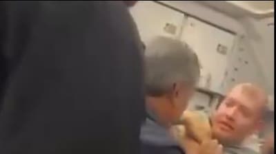 Screengrab from viral video of passengers cornering the alleged would-be hijacker (x.com/MarioNawfal) Screengrab from viral video of passengers cornering the alleged would-be hijacker (x.com/MarioNawfal)