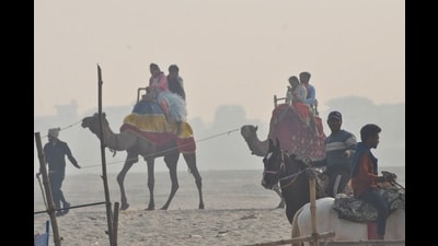 Visitors enjoy camel rides on a chilly Wednesday at a ghat in Varanasi (Rajesh Kumar) Visitors enjoy camel rides on a chilly Wednesday at a ghat in Varanasi (Rajesh Kumar)