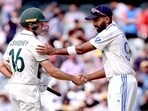India's Jasprit Bumrah (R) shakes hands with Australia's Nathan McSweeney India's Jasprit Bumrah (R) shakes hands with Australia's Nathan McSweeney