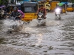 Vehicles move on a waterlogged road after heavy rain in Chennai. Vehicles move on a waterlogged road after heavy rain in Chennai.