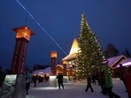 Tourists visit Santa Claus Village, a winter-themed amusement park perched on the edge of the Arctic Circle, in Rovaniemi, Finland. Tourists visit Santa Claus Village, a winter-themed amusement park perched on the edge of the Arctic Circle, in Rovaniemi, Finland.