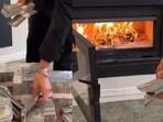 US influencer slammed for burning cash in viral video.