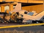 Caution tape surrounds the scene after a plane crashed on a highway in Texas. Caution tape surrounds the scene after a plane crashed on a highway in Texas.