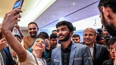 A fan takes a selfie with India's grandmaster Gukesh Dommaraju after his win against China's Ding Liren. The 18-year-old became the youngest world chess champion. (AFP) A fan takes a selfie with India's grandmaster Gukesh Dommaraju after his win against China's Ding Liren. The 18-year-old became the youngest world chess champion. (AFP)