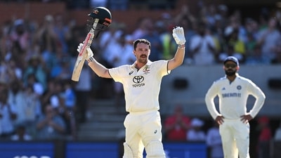 Travis Head celebrates his century at the Adelaide Oval vs India. (AAP Image via REUTERS)