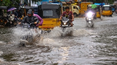 Vehicles move on a waterlogged road after heavy rain in Chennai. (PTI File) Vehicles move on a waterlogged road after heavy rain in Chennai. (PTI File)