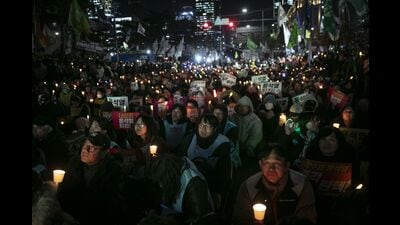 Protesters call for the resignation of South Korean President Yoon Suk Yeol during a candlelight demonstration outside the National Assembly building in Seoul, South Korea, on Friday, Dec. 6, 2024. Yoon lost the support of a key ally, increasing the chances he’ll be impeached in a vote set to take place over the next few days. Photographer: Woohae Cho/Bloomberg (Bloomberg) Protesters call for the resignation of South Korean President Yoon Suk Yeol during a candlelight demonstration outside the National Assembly building in Seoul, South Korea, on Friday, Dec. 6, 2024. Yoon lost the support of a key ally, increasing the chances he’ll be impeached in a vote set to take place over the next few days. Photographer: Woohae Cho/Bloomberg (Bloomberg)