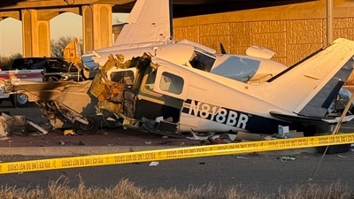 Caution tape surrounds the scene after a plane crashed on a highway in Texas. (AP) Caution tape surrounds the scene after a plane crashed on a highway in Texas. (AP)