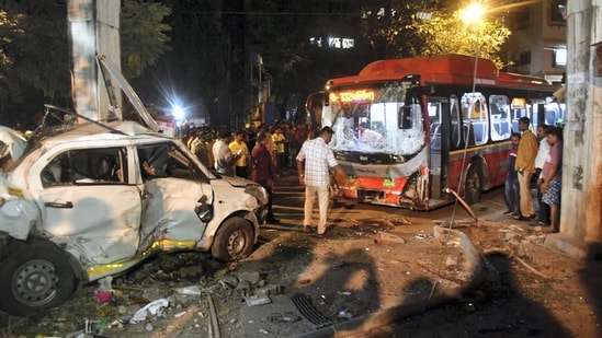 Mumbai: People gather near the wreckage of vehicles after a Brihanmumbai Electric Supply and Transport (BEST) undertaking's bus rammed into pedestrians as well as vehicles on a road at Kurla, in Mumbai. (PTI)