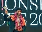 India's Gukesh Dommaraju celebrates with the World Chess Championship 2024 trophy. India's Gukesh Dommaraju celebrates with the World Chess Championship 2024 trophy.