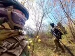 In this photo taken from video released by the Russian Defense Ministry Press Service on Tuesday, Nov. 26, 2024, a couple of Russian Army snipers walk changing their position while fighting with Ukrainian Armed forces at an undisclosed location in Ukraine. In this photo taken from video released by the Russian Defense Ministry Press Service on Tuesday, Nov. 26, 2024, a couple of Russian Army snipers walk changing their position while fighting with Ukrainian Armed forces at an undisclosed location in Ukraine.