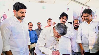 Andhra Pradesh chief minister N Chandrababu Naidu signs the document during the unveiling of the 'Swarna Andhra @ 2047 Vision Document', at the Indira Gandhi Municipal Stadium in Vijayawada on Friday. State Deputy Chief Minister Pawan Kalyan, Telugu Desam Party (TDP) General Secretary Nara Lokesh also present. (ANI) Andhra Pradesh chief minister N Chandrababu Naidu signs the document during the unveiling of the 'Swarna Andhra @ 2047 Vision Document', at the Indira Gandhi Municipal Stadium in Vijayawada on Friday. State Deputy Chief Minister Pawan Kalyan, Telugu Desam Party (TDP) General Secretary Nara Lokesh also present. (ANI)