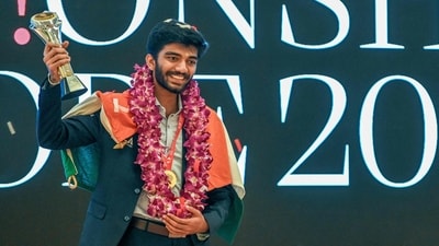 India's Gukesh Dommaraju celebrates with the World Chess Championship 2024 trophy. (AFP) India's Gukesh Dommaraju celebrates with the World Chess Championship 2024 trophy. (AFP)