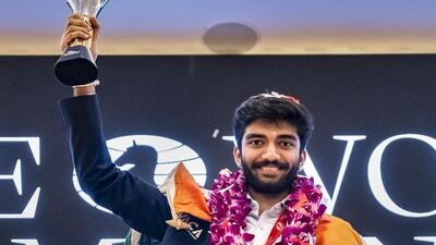 India's D Gukesh with the world chess championship trophy in Singapore on Friday (PTI) India's D Gukesh with the world chess championship trophy in Singapore on Friday (PTI)