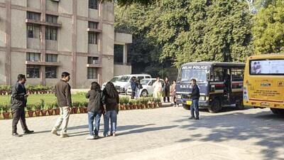 Security personnel and school administration officials inside the premises of the Cambridge School at Shri Niwas Puri after it received bomb threat over email (PTI) Security personnel and school administration officials inside the premises of the Cambridge School at Shri Niwas Puri after it received bomb threat over email (PTI)