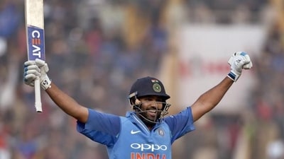 Rohit Sharma celebrates after scoring his third double century during the second one-day international match against Sri Lanka in Mohali. (AP) Rohit Sharma celebrates after scoring his third double century during the second one-day international match against Sri Lanka in Mohali. (AP)